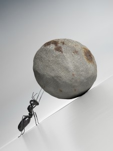 A single ant pushing a rock up a steep slope. Very high resolution 3D render.