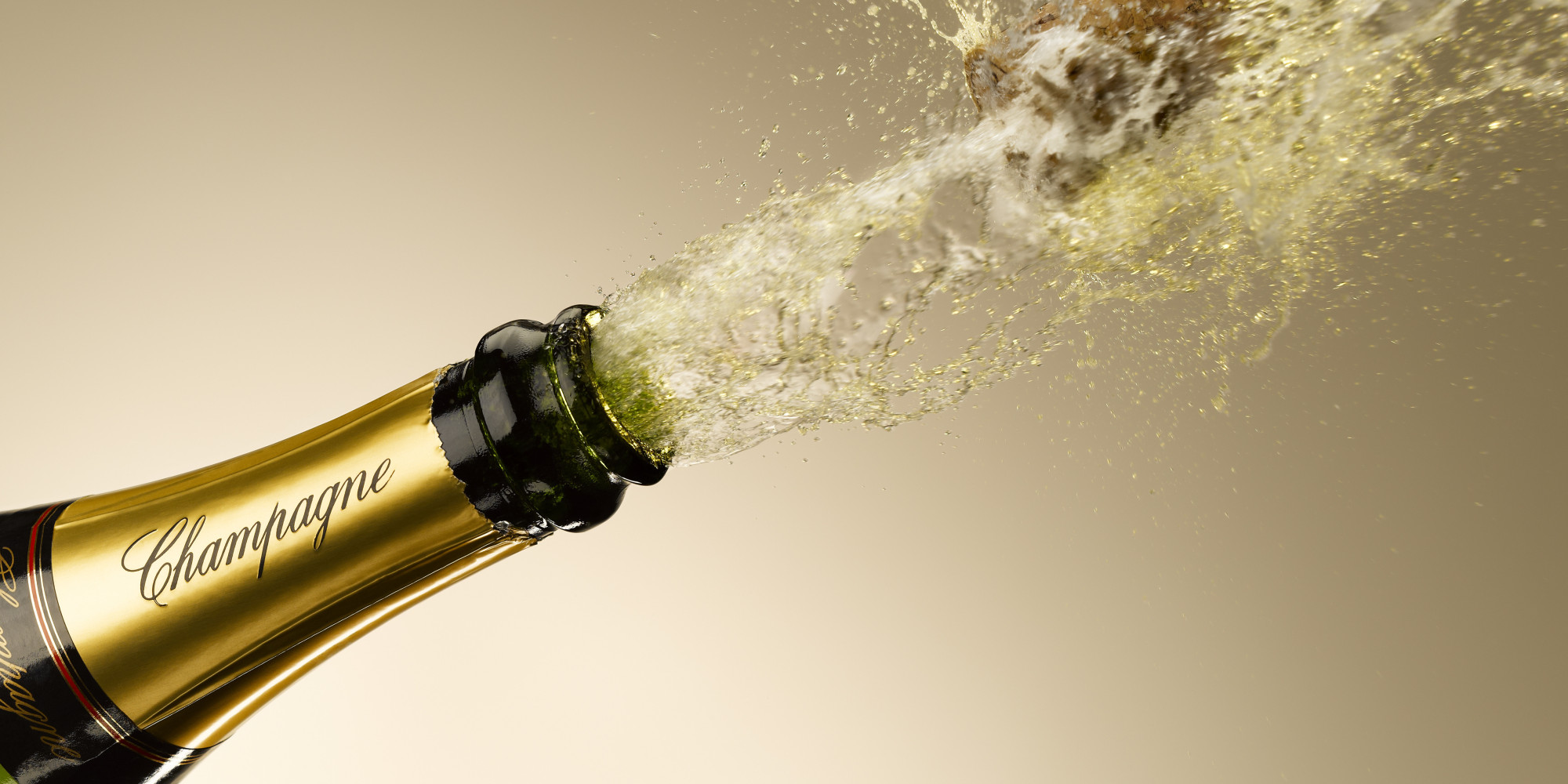 Champagne and cork exploding from bottle