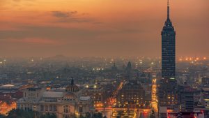 Torre Latinoamericana Amidst Buildings In City At Sunset