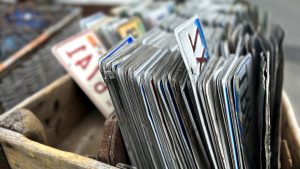 vintage vehicle license plates for sale at flea market