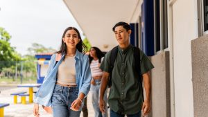 Teenage students walking on the school