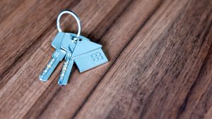 Close-up of house keys on a wooden table