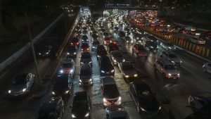 Rush hour traffic on freeway at night, Mexico City, Mexico