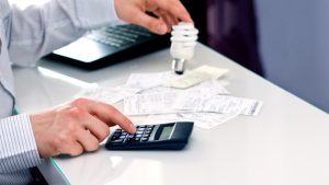 Man thinking about saving money. New solutions in lighting