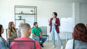 Mid adult woman doing a presentation during meeting