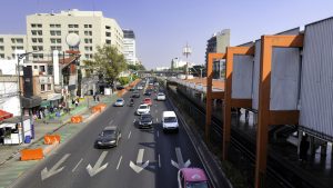 Cityscape at Calzada de Tlalpan street in Mexico City, with subway station at right.