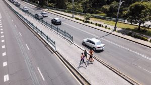 High angel view of runners on pathway in city