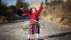 Young girl with hoola hoops