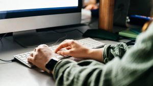 Close Up Of Student Typing During Seminar