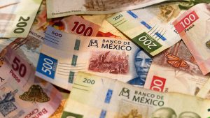 Several Mexican banknotes of various denominations.