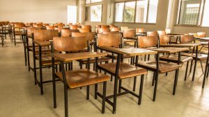 Old scattered chairs in the classroom.