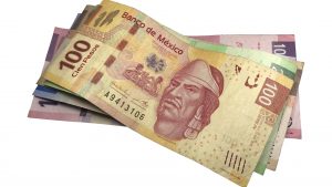 A bunch of mexican peso bills isolated on white background