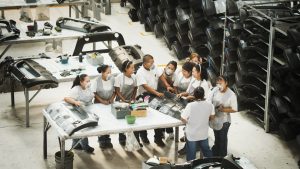 Workers talking in manufacturing plant