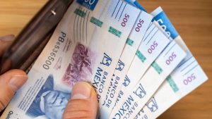 Money in Mexico. Financial business concept. Mexican banknotes taken out of wallet, denominations of 500 pesos, close up
